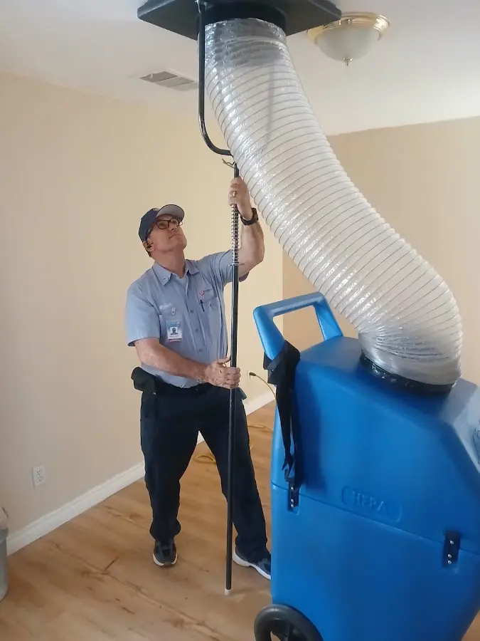 Furnace Tune-Up technician using HEPA equipment in Santa Fe